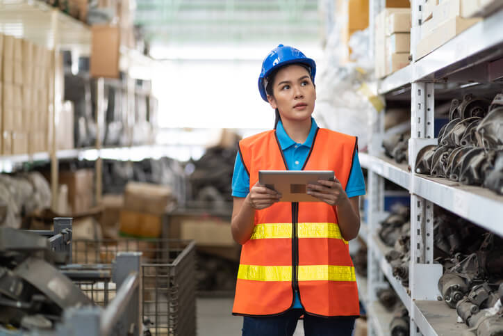 A female parts manager in an auto parts store after automotive parts training