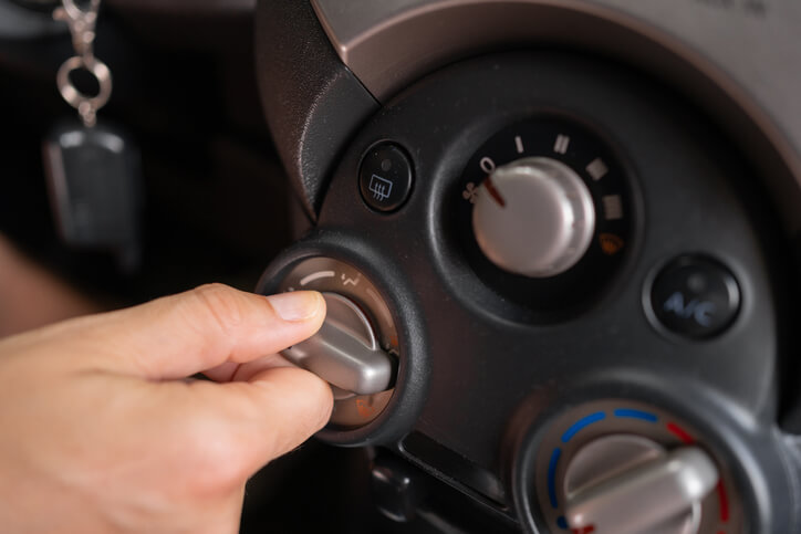 An auto repair technician tuning a car’s cooling stick after auto mechanic training