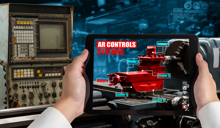 A budding auto mechanic using augmented reality software in automotive school