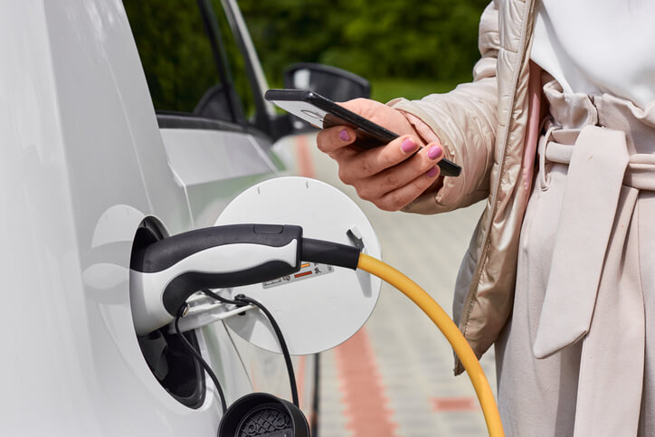 A public car charging station maintained by automotive school grad