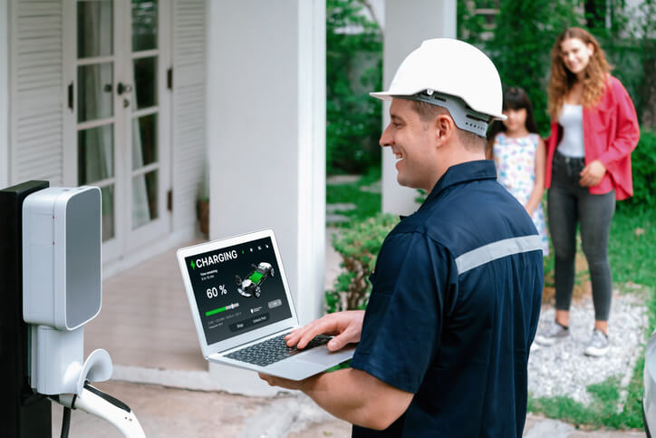 An automotive school grad maintaining a home charging station