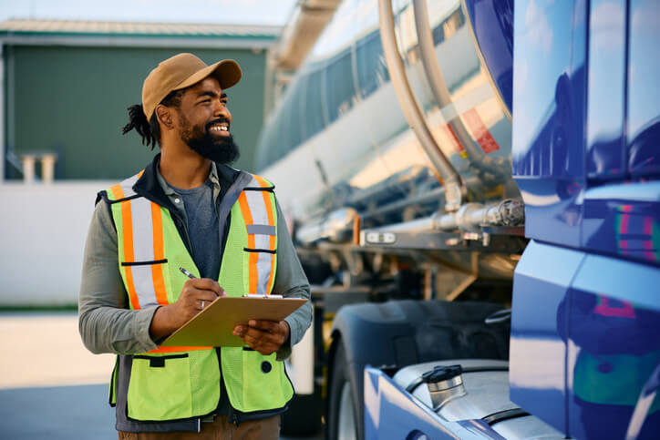 A male dispatcher examining a truck before the ride after dispatch college