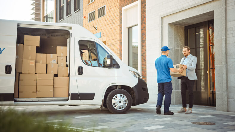  A male parts driver completing a delivery after automotive training