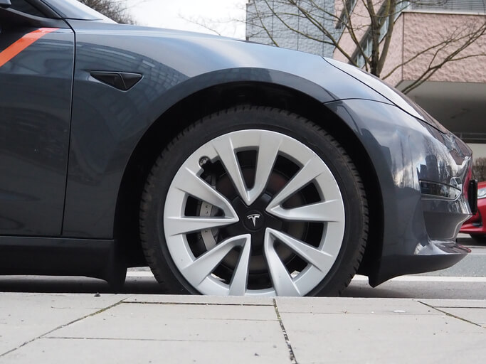 A side view of an autonomous Tesla car to be explored in automotive technology training