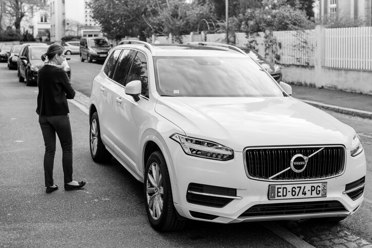 A Volvo SUV and its owner after hybrid and electrical mechanic training