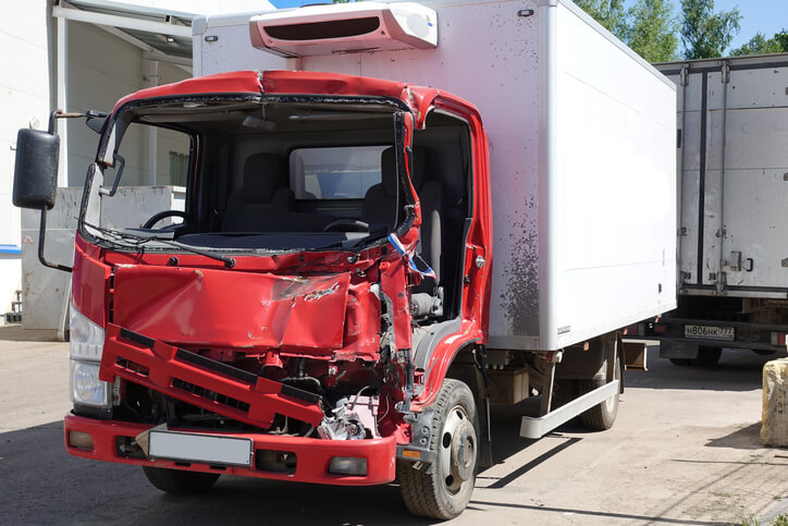 A heavy-duty vehicle damaged after an accident, as one explored in auto body estimating training