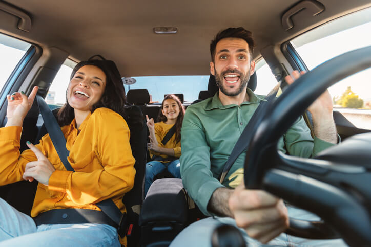 An auto mechanic training grad travelling in a car with his family