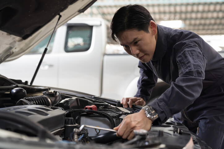 A mechanic restoring a classic vehicle after auto mechanic school