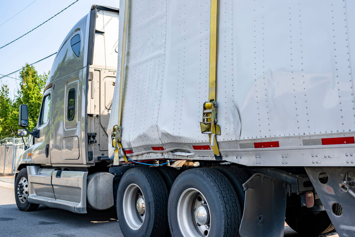 A heavy-duty vehicle with a broken dry van to be explored in auto body estimating training