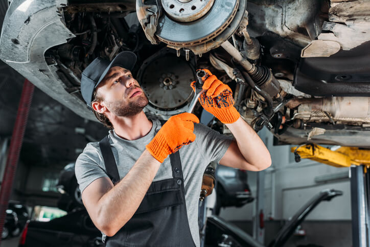 Auto mechanic at a repair shop after auto mechanic school