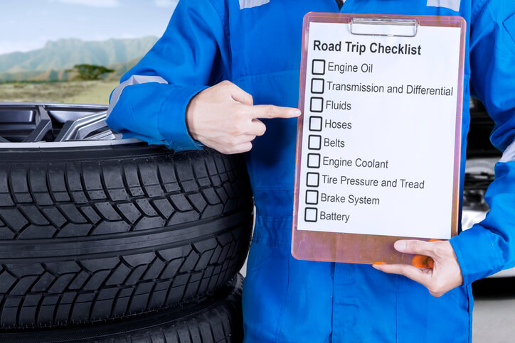 An auto mechanic giving road trip tips after completing his auto body training