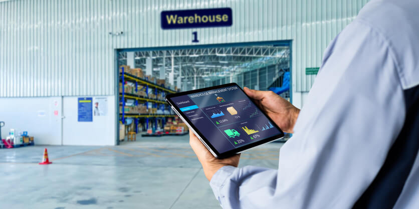 A male warehouse manager checking the inventory after dispatch training