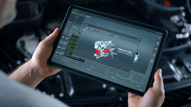 An auto mechanic holding a digital diagnostic scanner