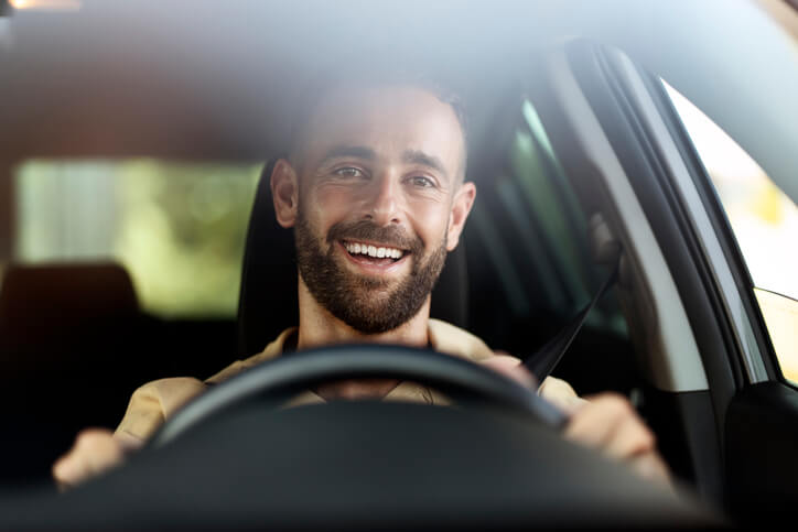 An automotive school student taking an EV on a test drive