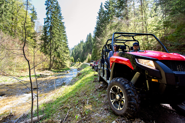 A couple on an off-road driving excursion in automotive training