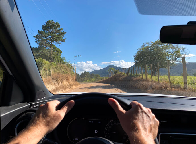 An automotive training student driving a vehicle on an off-road track