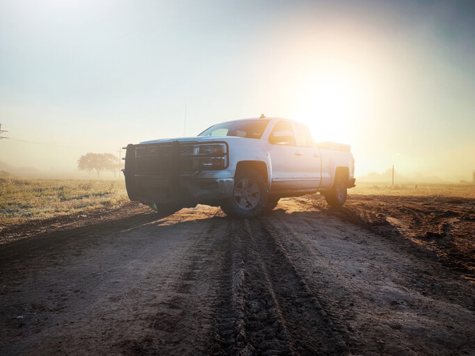 A work truck driving on an off-road track, to be explored in automotive training