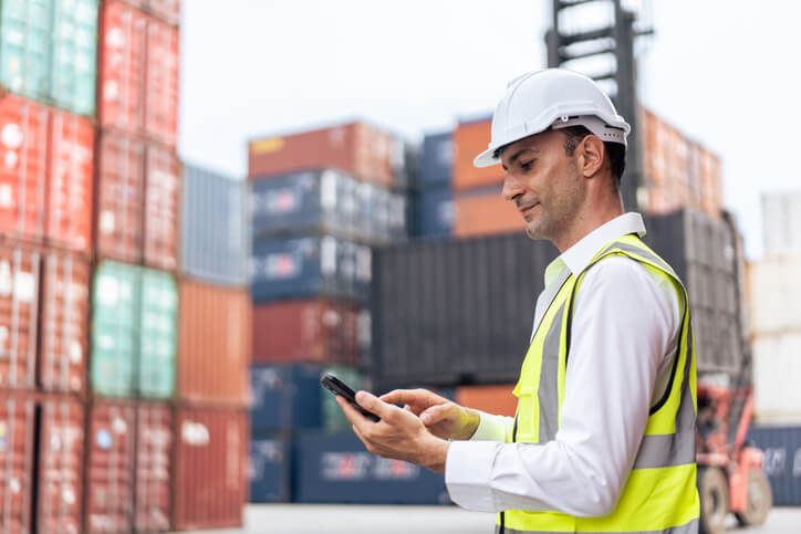 A male load planner at a warehouse after completing his dispatch training