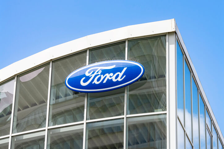 An image of the logo of Ford at a dealership to be explored in automotive school