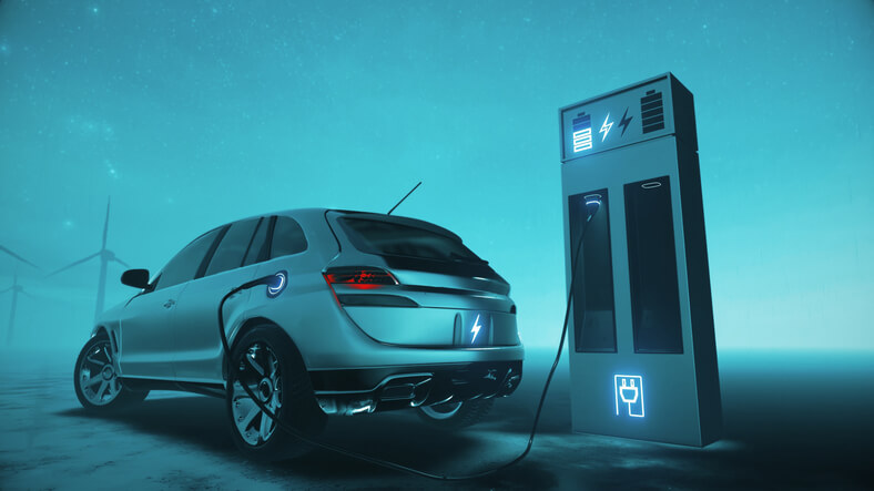 A concept image: hybrid and electric vehicle mechanic charging a hybrid SUV