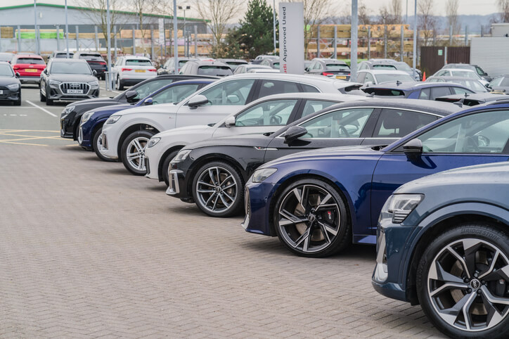 A row of perfectly prepped cars at a dealership, to be explored in auto detailing training