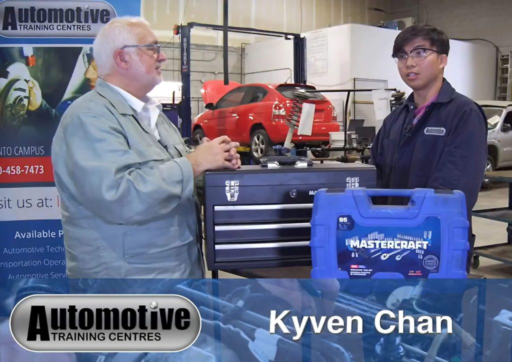 An automotive school student being interviewed in a shop