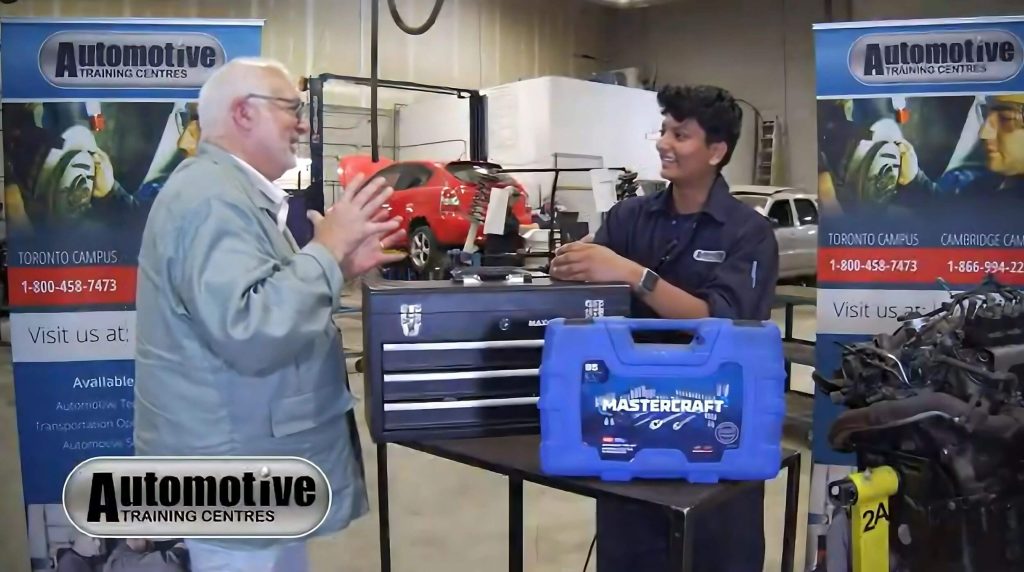 A budding auto mechanic, Niharika Limaye, interacting with a trainer