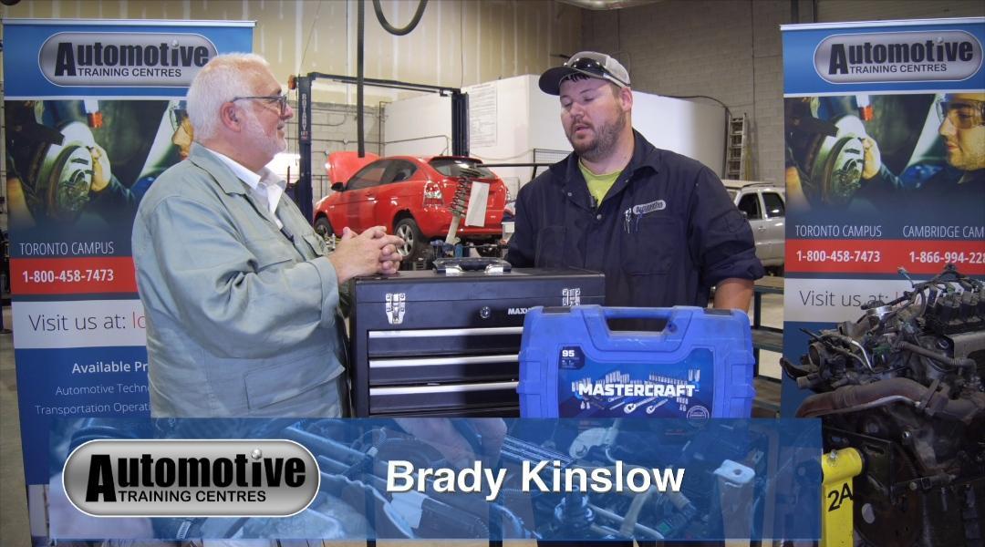 Brady Kinslow with an instructor at our automotive school