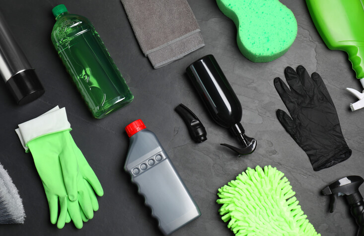 An environmentally conscious auto detailing setup featuring natural cleaning products and tools