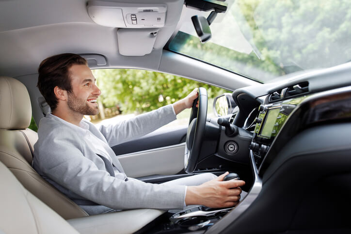 An automotive technology training student exploring UX features in a hybrid vehicle.