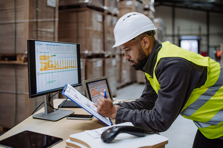 A logistics professional reviewing expenses for fleet management after dispatch training